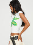 side view of model wearing Princess Polly Tiona Summer Flower Top White / Lime Short Sleeves Crew Neck 