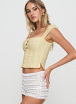 side view of model wearing Princess Polly Lyncher Top Yellow Short Sleeves Square Neck 