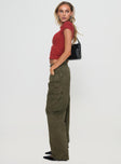 side view of model wearing Princess Polly Ahstin Cargo Jeans Green Petite Mid Rise 