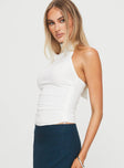 side view of model wearing Princess Polly Merril Halter Top White Sleeveless High Neck 