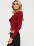 side view of model wearing Princess Polly Matrid Long Sleeve Top Burgundy Full Sleeves Asymmetric Neckline 