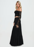   side view of model wearing Princess Polly Mya Maxi Skirt Black Maxi 