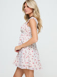 side view of model wearing Princess Polly Carlita Mini Dress White Floral Sweetheart Neckline 