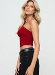 side view of model wearing Princess Polly Annem One Shoulder Top Red Sleeveless Asymmetric Neckline 