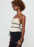 side view of model wearing Princess Polly Daxon Top Cream / Black Sleeveless Square Neck 