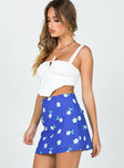   side view of model wearing Princess Polly Selby Mini Skirt Blue Floral 