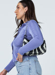 side view of model wearing Princess Polly Elody Long Sleeve Top Light Blue 