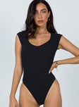 front view of model wearing Princess Polly Carey Bodysuit Black Tall Short Sleeves Scoop Neck 