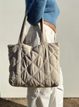 Beige tote bag Quilted design  Contrast stitching  Twin handles  Zip fastening Three internal pockets Fully lined