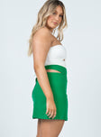   side view of model wearing Princess Polly Amara Cut Out Mini Skirt Green 