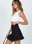   side view of model wearing Princess Polly Rescue Me Pleat Mini Skirt Black Denim 