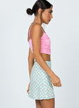   side view of model wearing Princess Polly Selby Mini Skirt Green Floral Check 