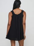 back view of model wearing Princess Polly Swing Mini Dress Black Petite Square Neck 