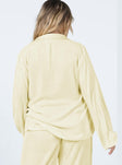 back view of model wearing Princess Polly Taina Pleated Shirt Cream Full Sleeves V-Neck 