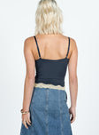 Front view of model wearing  front Princess Polly Sleeveless Square Neck  Top Model Cami Top Navy