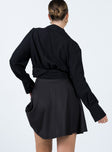 back view of model wearing Princess Polly Em Mini Skirt Black 