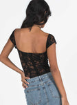 Front view of model wearing  front Princes Polly Short Sleeves  Cadrot Lace Bodysuit Black