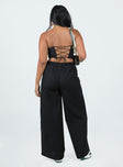 Front view of model wearing  front Princess Polly High Waisted Pants High Waisted Pants High Waisted Pants High Waisted Pants  Brunie Pants Black