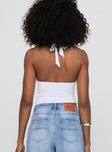 back view of model wearing Princess Polly Chilli Halter Top White Sleeveless Plunger 