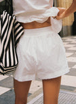 back view of model wearing Princess Polly Dobby Shorts White High Waisted Shorts 