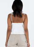 back view of model wearing Princess Polly Brearley Top White Sleeveless Plunger 