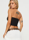 back view of model wearing Princess Polly Mani Top Black Sleeveless Sweetheart 