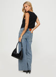 back view of model wearing Princess Polly Jewelz Wide Leg Jeans Light Wash Mid Rise 