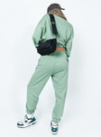 back view of model wearing Princess Polly Club Basic Trackpants Sage 