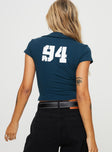 back view of model wearing Princess Polly 94 Kicker Zip Top Navy Short Sleeves Plunger 