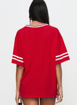 back view of model wearing Princess Polly Austin Texas Sports Jersey Top Red Half Sleeves V-Neck 