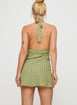 back view of model wearing Princess Polly Kopra Halter Mini Dress Green Plunger 