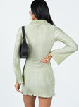 back view of model wearing Princess Polly Danyon Mini Dress Green V-Neck 