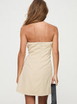 back view of model wearing Princess Polly Langdon Strapless Mini Dress Beige Straight Neck 