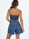 back view of model wearing Princess Polly Lou Carpenter Denim Shorts Mid Wash High Waisted Shorts 