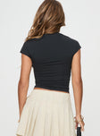 back view of model wearing Princess Polly Little Miss Top Black Short Sleeves High Neck 