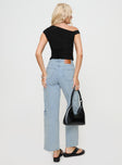 back view of model wearing Princess Polly Nosita Cargo Jeans Light Wash Mid Rise 