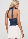 back view of model wearing Princess Polly Yukiyo Denim Top Mid Wash Sleeveless V-Neck 