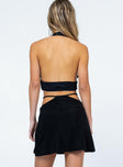 back view of model wearing Princess Polly Gina Knitted Low Waist Mini Skirt Black 