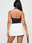 back view of model wearing Princess Polly Maceline Wrap Front Skort White High Waisted Shorts 