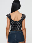 back view of model wearing Princess Polly Beckinsale Polka Top Black Short Sleeves Scoop Neck 