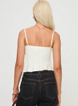 back view of model wearing Princess Polly Lance Top Cream Sleeveless Plunger 