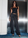 side view of model wearing Princess Polly First Place Low Rise Satin Pant Black Low Rise Pants 