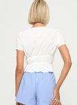 back view of model wearing Princess Polly Davist Top White Short Sleeves Plunger 