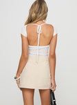 back view of model wearing Princess Polly Cadern Skort Cream High Waisted Shorts 