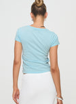 back view of model wearing Princess Polly Cheers To You Tee Blue Short Sleeves Crew Neck 