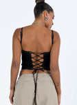 Front view of model wearing  front Princess Polly Sleeveless Square Neck  Buckle Up Top Black