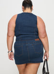 back view of model wearing Princess Polly Popular Low Rise Mini Skirt Mid Blue Wash Curve Mini Skirts 