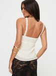 back view of model wearing Princess Polly Taini Top Cream Sleeveless Plunger 