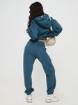 back view of model wearing Princess Polly Princess Polly Track Pants Block / Cursive Text Slate Mid Rise 