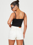 back view of model wearing Princess Polly Katlynne Denim Mini Skort White mid-rise 